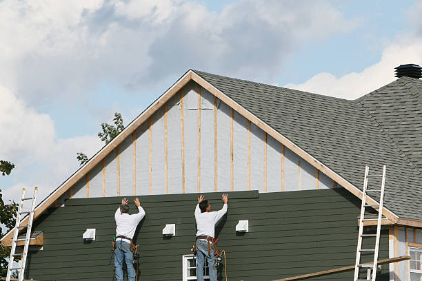 Professional Storm Damage Siding Repair technician working in Spring, TX